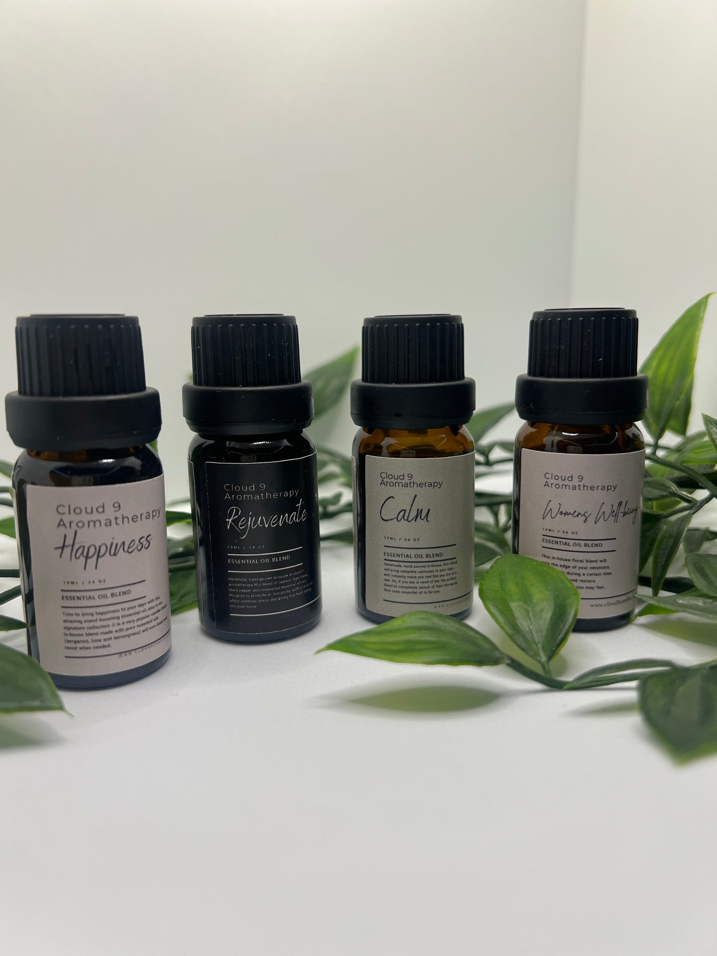 Choose any two handcrafted essential oil blends from Cloud 9 Aromatherapy, displayed in amber bottles with natural styling.
