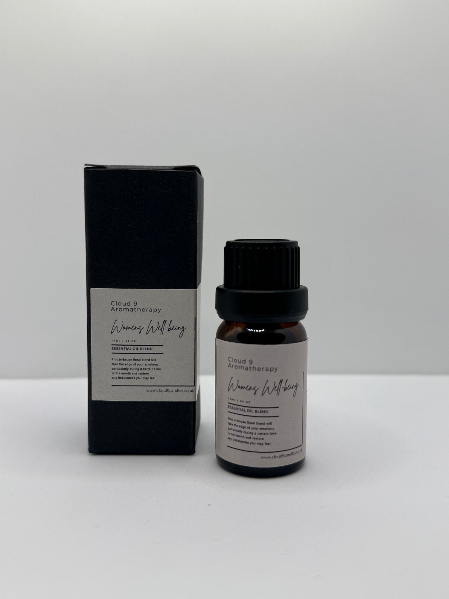 Women’s Well-Being 10ml essential oil blend bottle styled with soft natural lighting, representing self-care, stress relief, and hormonal balance.