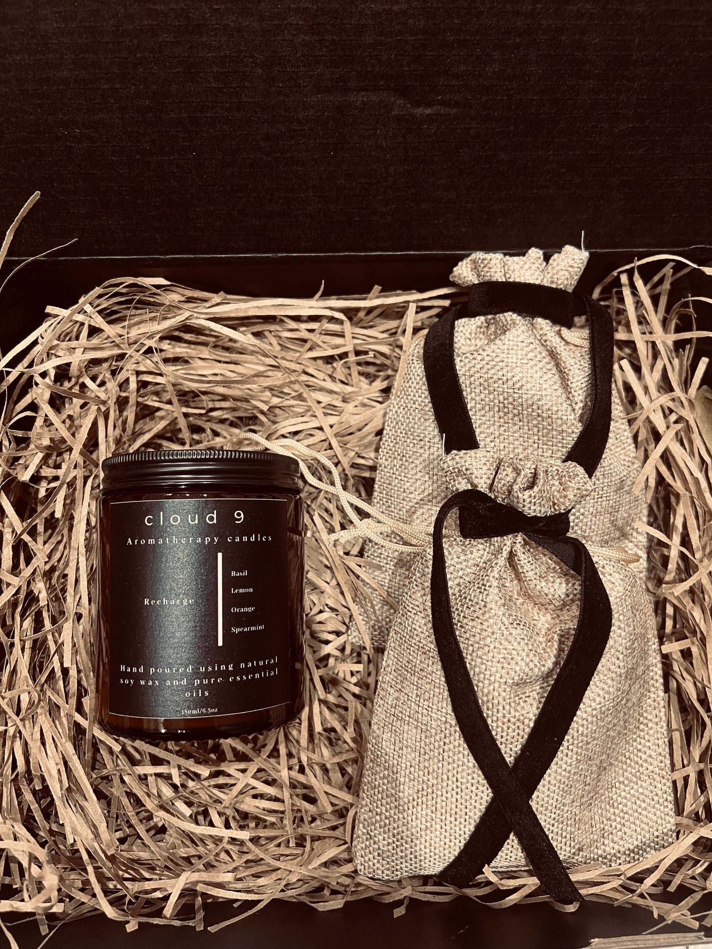 One Aromatherapy candle and two wax melt bags
