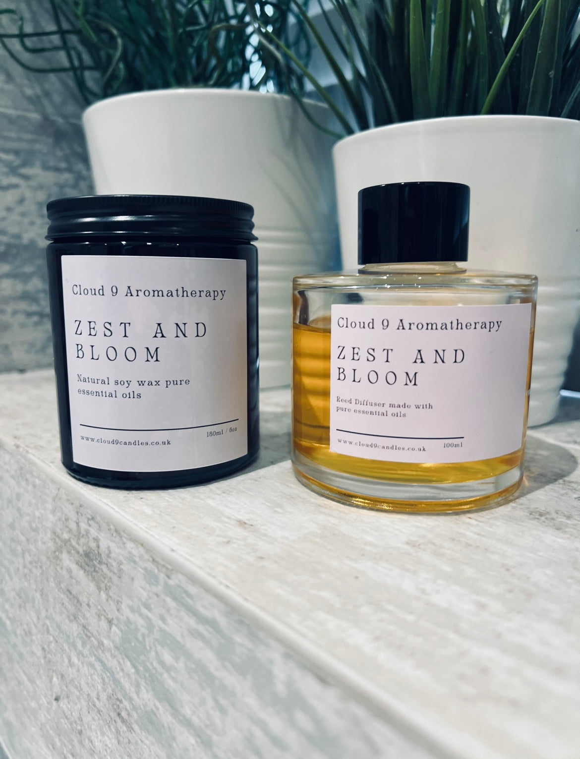Cloud 9 Aromatherapy Zest & Bloom candle burning, creating a calming and fragrant atmosphere at home.