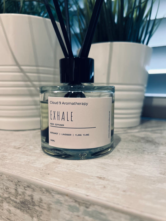 Exhale reed diffuser with bergamot, lavender and ylang ylang essential oils in glass jar and black fibre reeds 