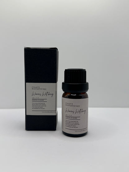 Women’s Well-Being 10ml essential oil blend bottle styled with soft natural lighting, representing self-care, stress relief, and hormonal balance.