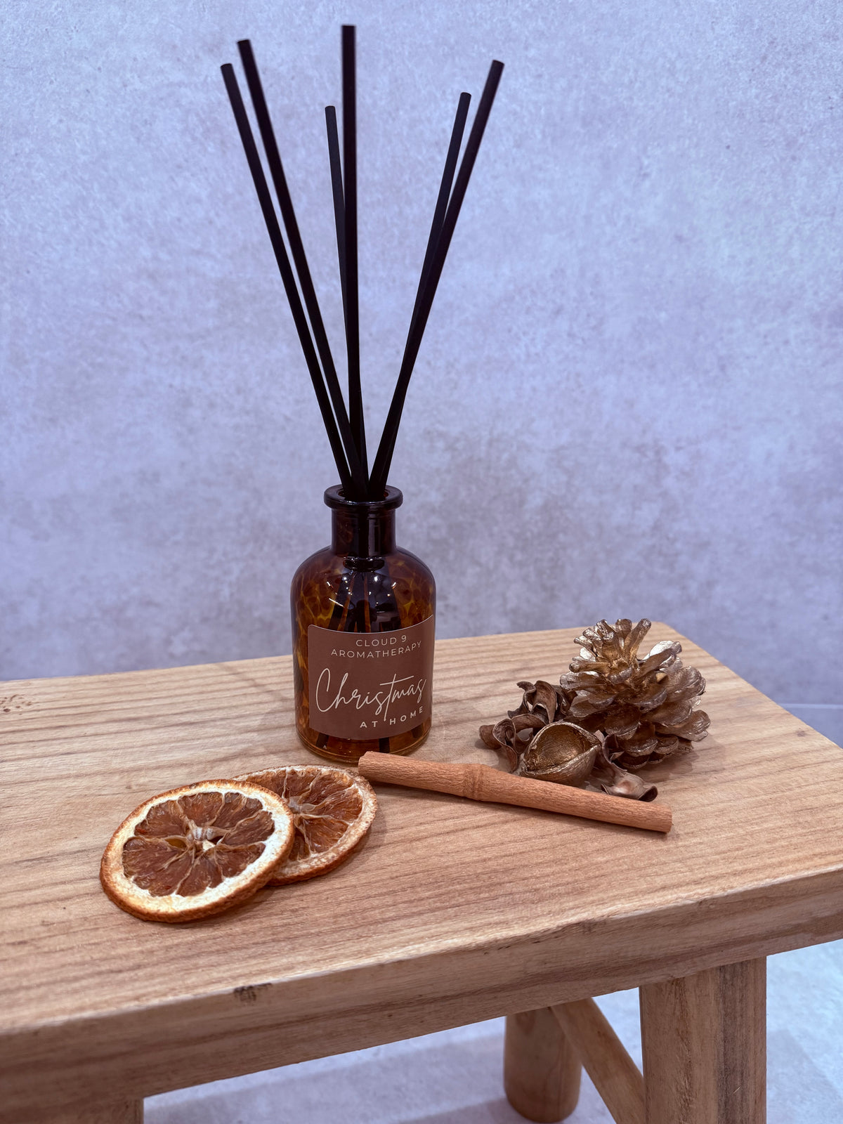 Close-up of the Christmas at Home reed diffuser by Cloud 9 Aromatherapy, showcasing its festive product design.