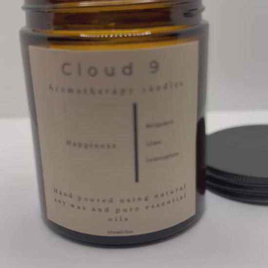 Eco-friendly packaging of Happiness Candle with Cloud 9 branding