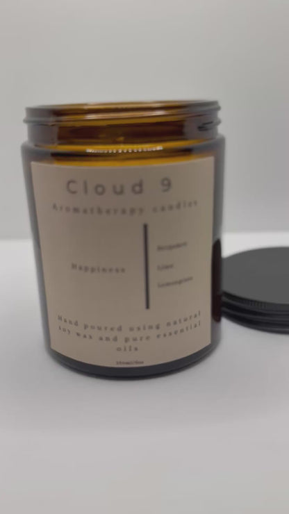 Eco-friendly packaging of Happiness Candle with Cloud 9 branding